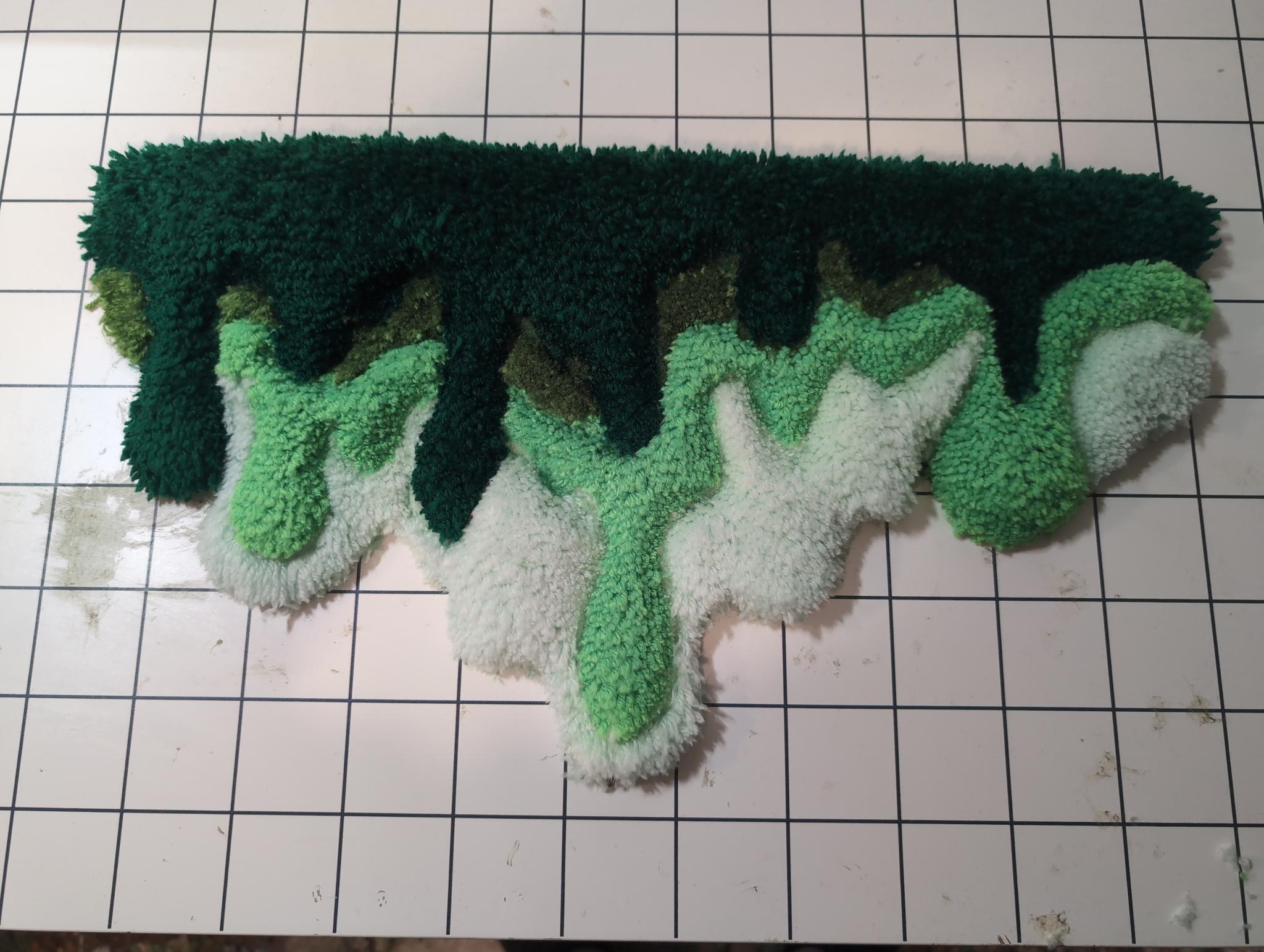 Drippy, fluid, and carved green fiber piece