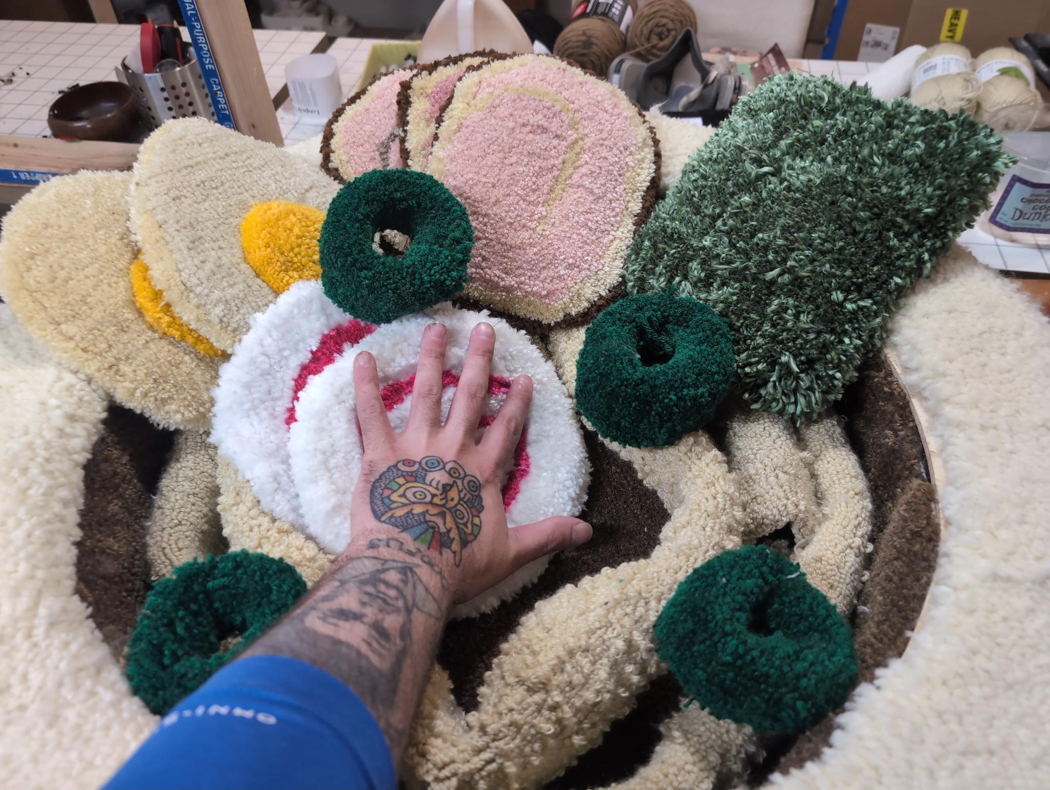 A tattooed hand resting on the naruto for scale, dwarfed by the bowl